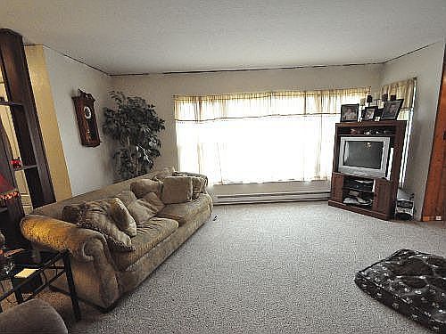  Large front picture window gives the family room and plenty of natural light.
