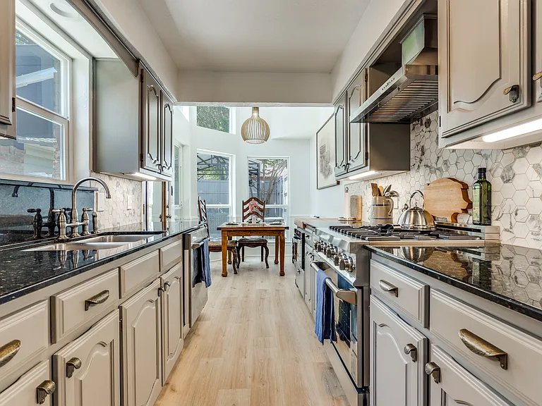 Galley kitchen looking towards yard