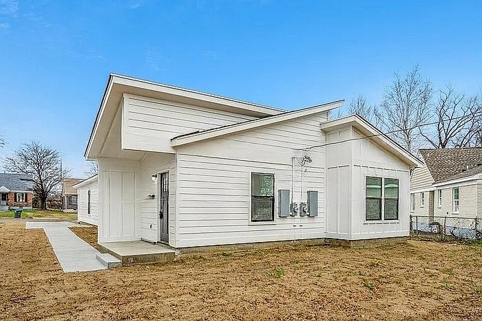 Modern townhouse featuring a well-kept exterior, private driveway, and secure entryoffering residents comfort and peace of mind