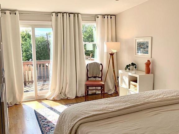 Master Bedroom with tons of natural light and sliding door out to the private balcony.