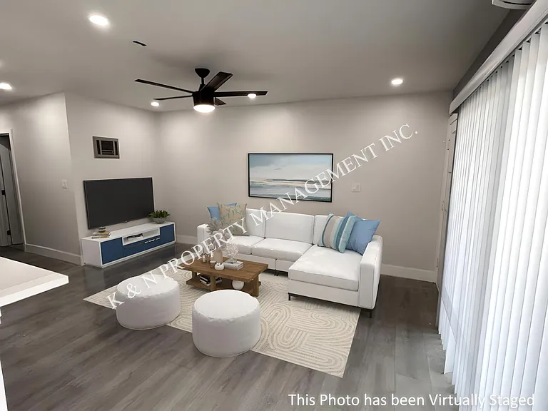 Living room with large sliding glass door opening to the patio
