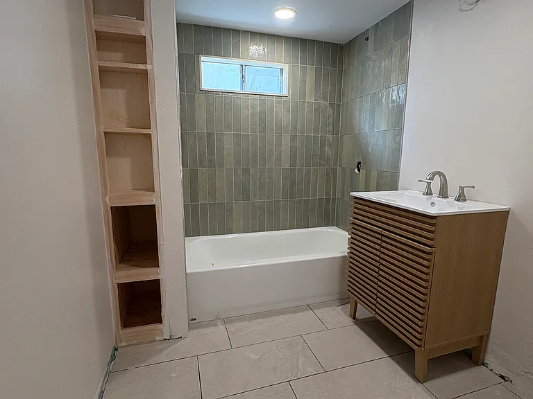 This bathroom is accessible from the great room. Your visitors don't have to use your master bathroom. This is close and easy.