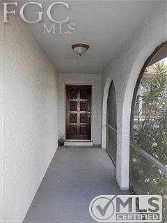5.5 FT BY 20 FT. SCREENED FRONT ENTRY WITH ARCHED WALL OPENINGS * SOLID WOOD 8-PANEL FRONT DOOR * PRIVATE AND NICE ENTRY * EXTRA SHARP HOME....INVITES INSPECTIONS!!