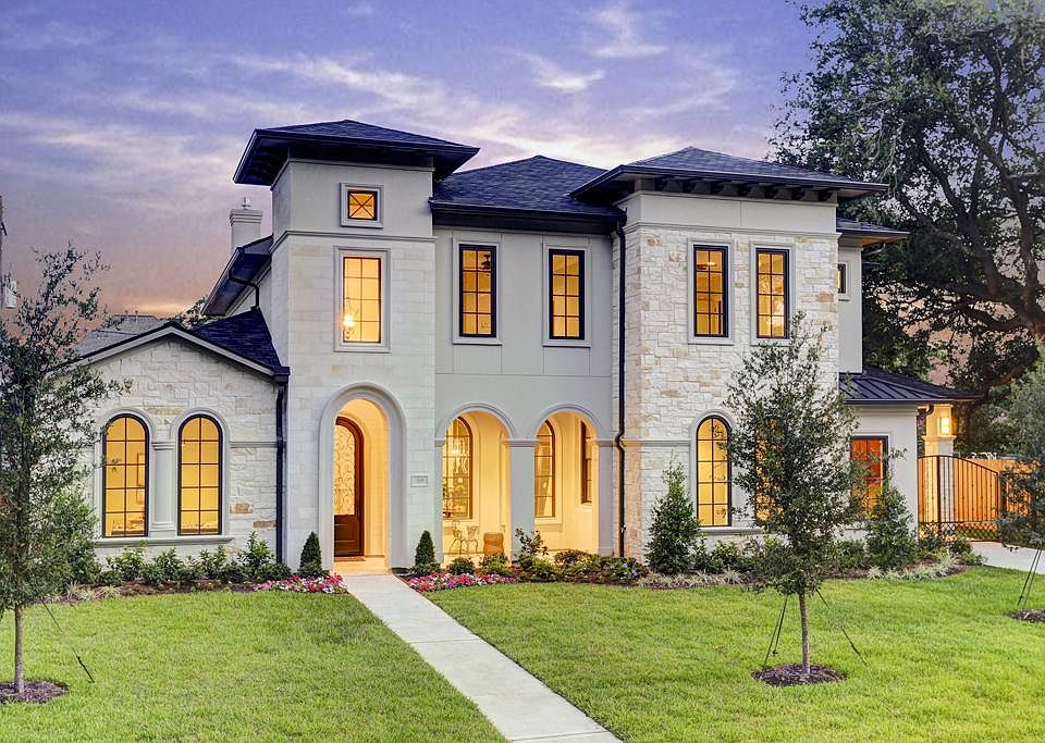 Warm limestone & stucco wrap this Mediterranean/Soft Contemporary new construction home on a huge lo