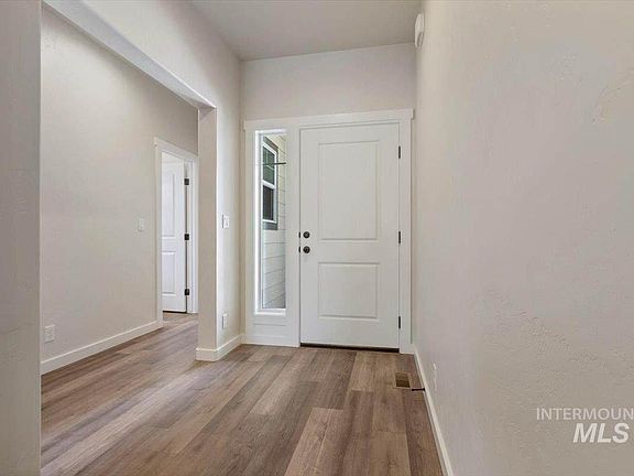 Welcoming Front Hallway and entry to the Front and Middle Bedrooms and Main Bathroom