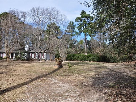 Driveway and parking area is located on the second lot.  Owners made a circle driveway area.