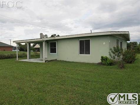 Carport leads to utility/laundry room