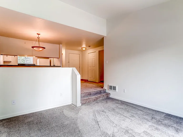 A Standard Living Room and Kitchen at The Courtyard at South Station