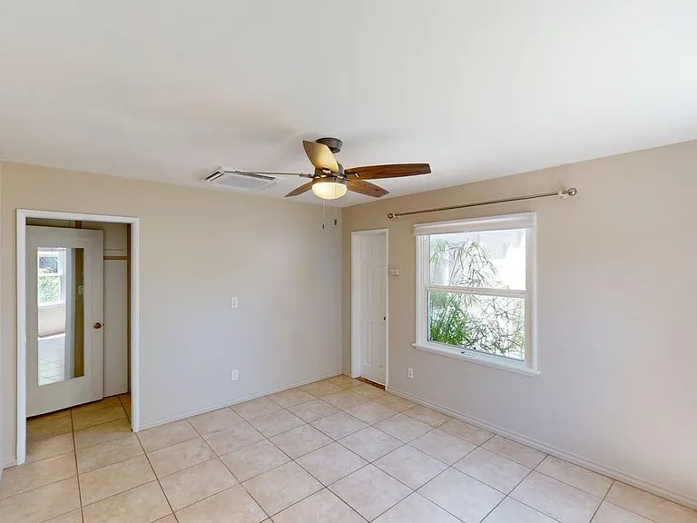 living room showing hall and door to the 2nd room