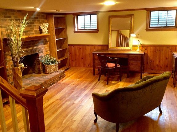 Downstairs Den : The warmth of solid wood floors and rich wainscoting make this room a favorite.