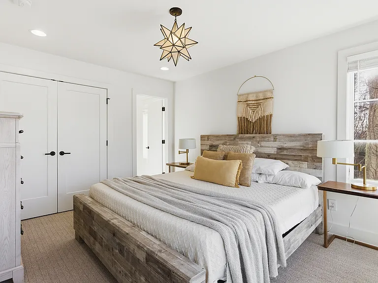 Bedroom 2 with a king bed and ensuite bath. Located on the 1st floor. Tastefully decorated with high-end modern furnishings and thoughtful touches to make your stay as comfortable as possible.