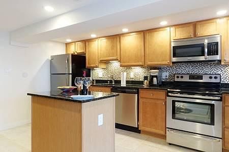 Kitchen with stainless steel appliances and granite countert