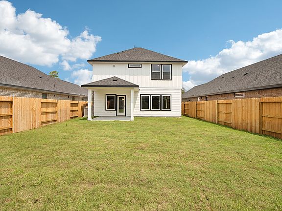 The backyard of a home in Harper s Preserve of Conroe, TX.