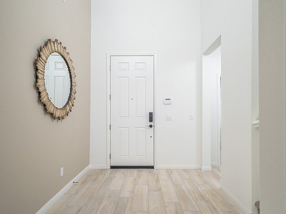 A soaring 2-story ceiling in the foyer greets you in the Preston.
