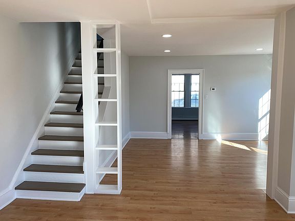 Living room looking into dining room & kitchen