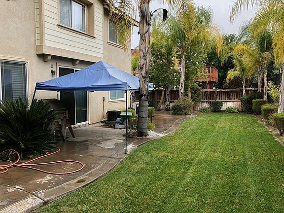 Backyard turn to both sides with patios on both sides of the