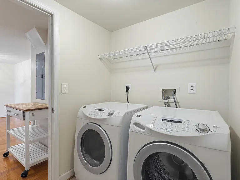 Separate laundry room with a little area for storage