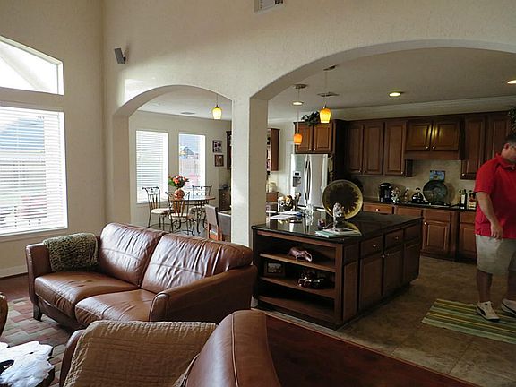 Beautiful Archways Open to Kitchen and Breakfast Areas.