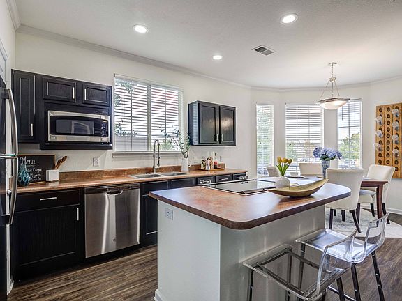 Fully Equipped Gourmet Kitchen with Black Appliances *