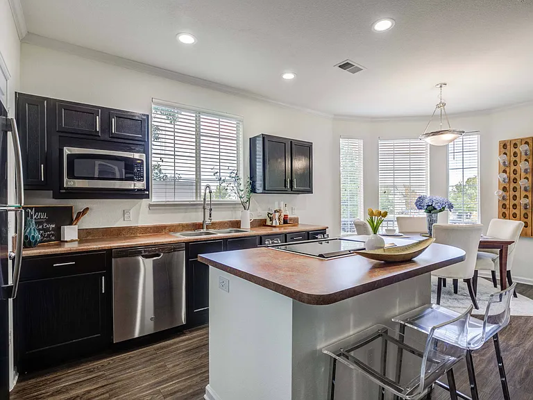 Fully Equipped Gourmet Kitchen with Black Appliances *