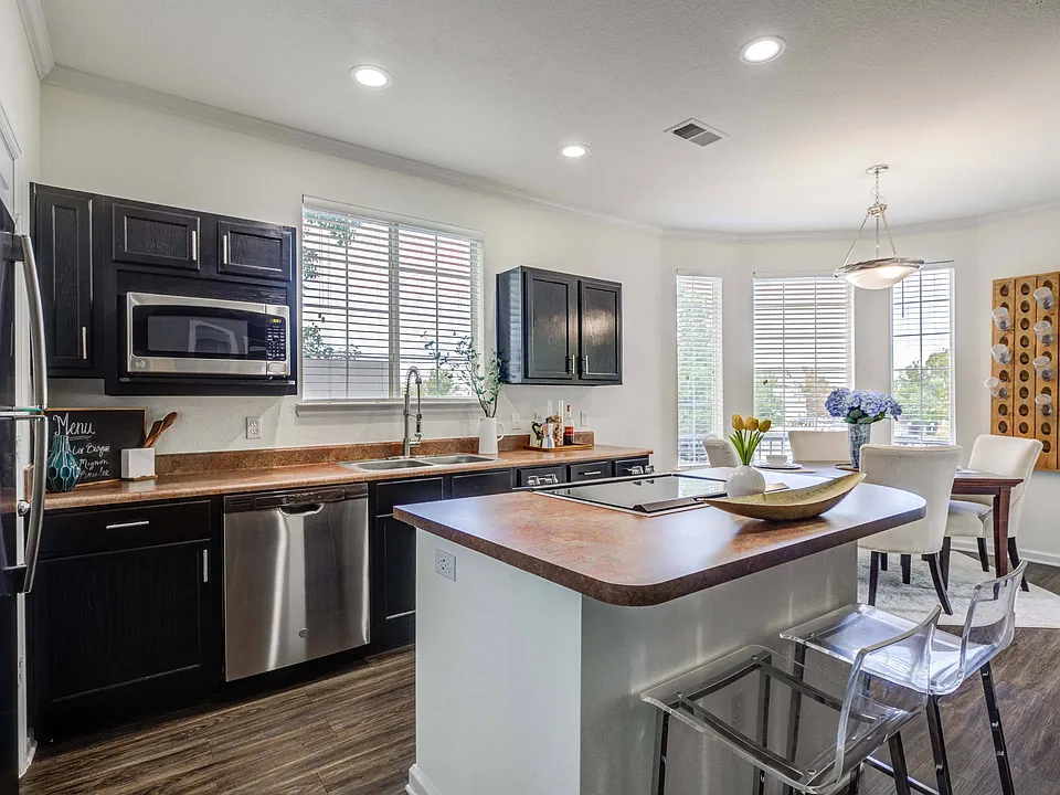 Fully Equipped Gourmet Kitchen with Black Appliances *