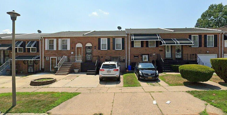 Outside front view of house with 2 car off street parking.