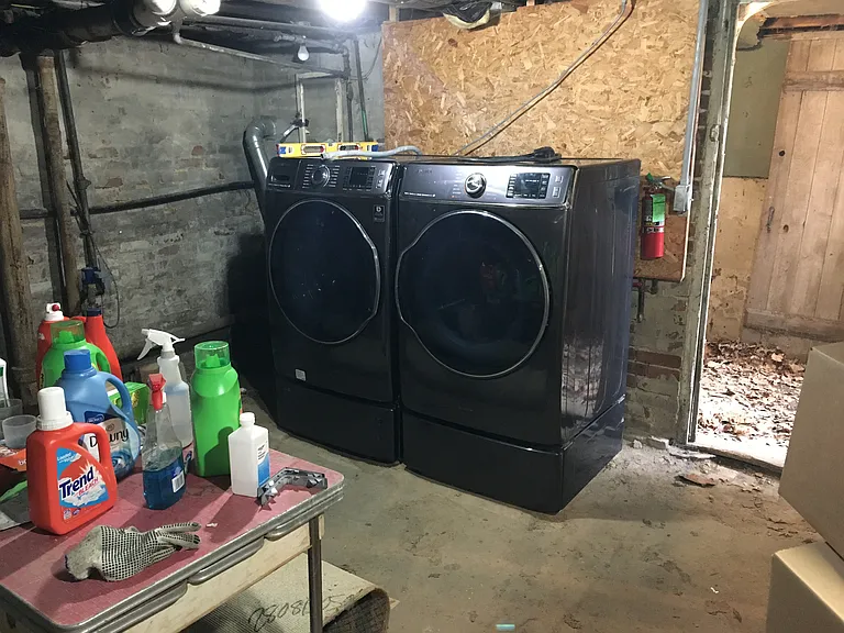 Shared laundry equip in basement room
