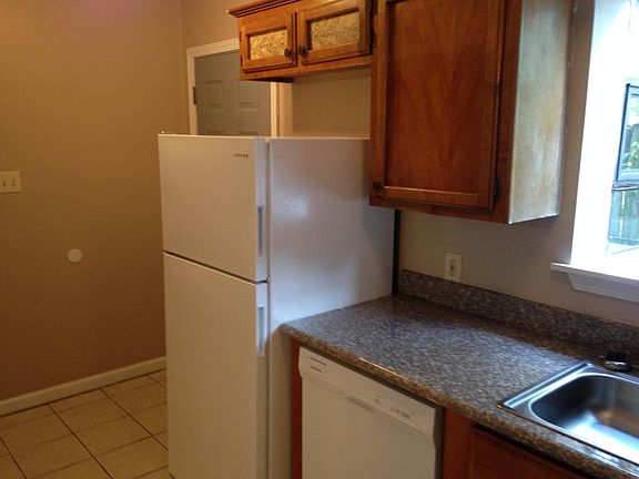 Kitchen showing dishwasher, refrigerator