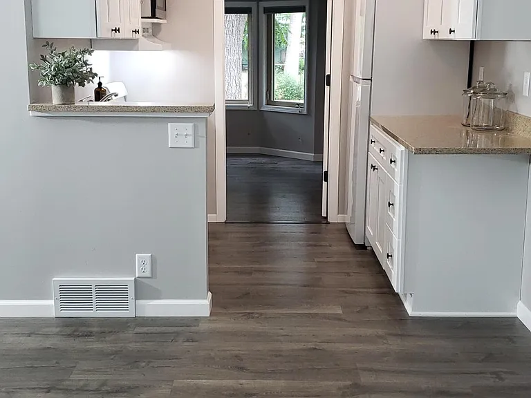 Kitchen (refrigerator, microwave, stove/oven). New white cabinets, granite countertops.