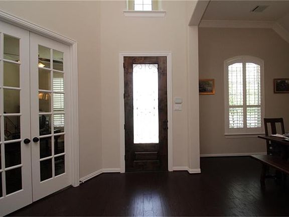 Looking back at the front door, dining room on right.