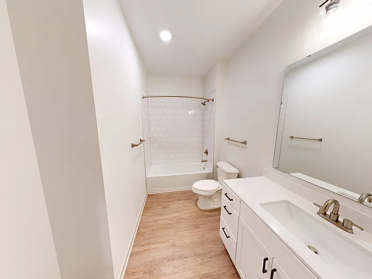 The Eleanor features a spacious bathroom with a large vanity, linien closet, and showe-bathtub. The Eleanor features a spacious bathroom with a large vanity, linien closet, and showe-bathtub.