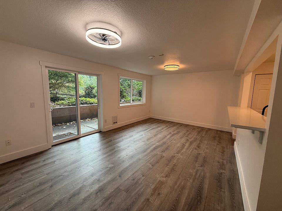 Dining and living room with ceiling fan and light