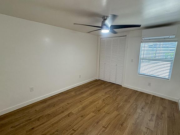 Large Bedroom with Ceiling Fan on Remote.