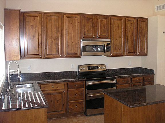 Granite & Knotty Alder Cabinets