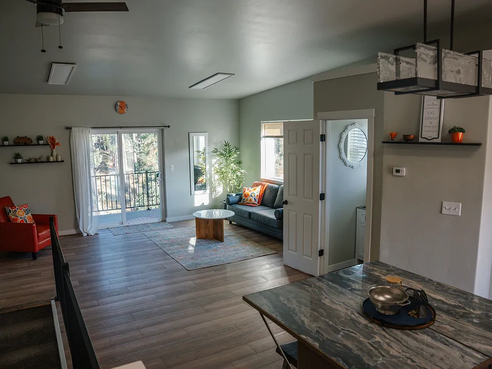 Spacious living room with balcony all decor included (sectional couch added)