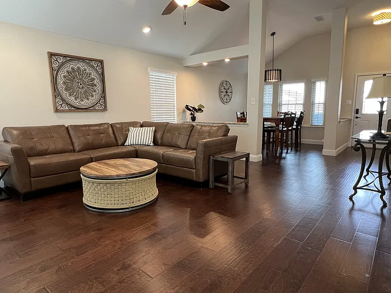 Comfortable open living area with designer furnishings and abundant natural light.