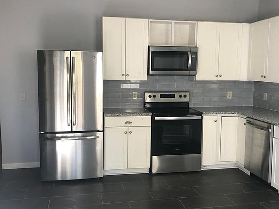 recessed lighting and bright kitchen