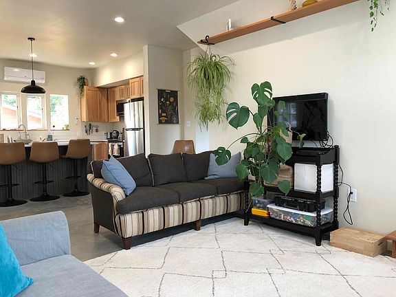 The living room, and other downstairs areas, have a polished concrete heated floor keeping your toes warm in the winter ;)