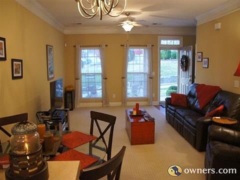 Open concept living/dining room with views of the park