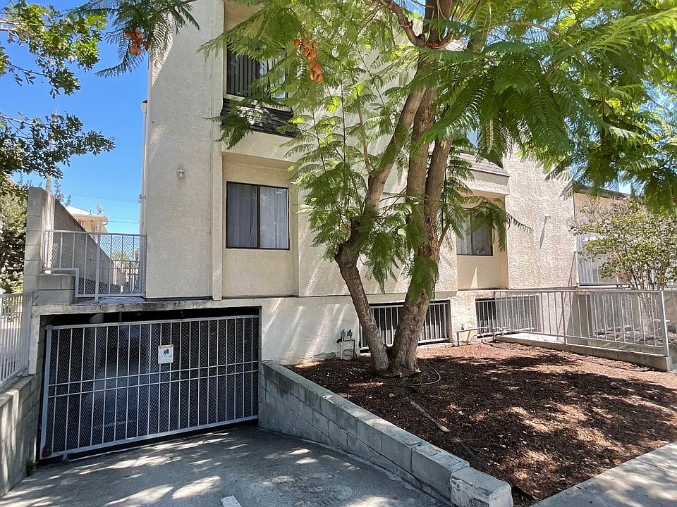 Front of building, featuring gated garage door