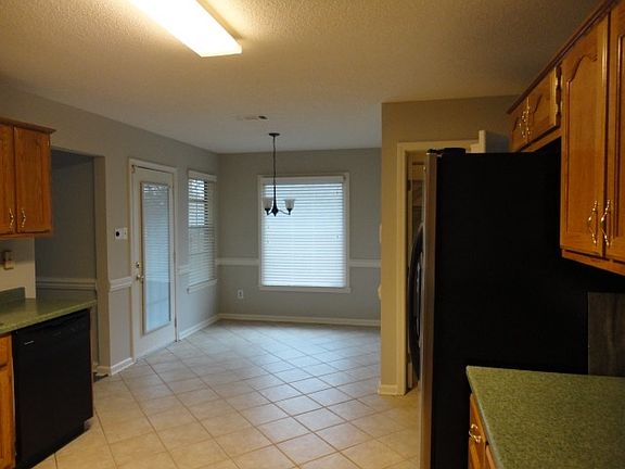 Eat-kitchen with tile flooring