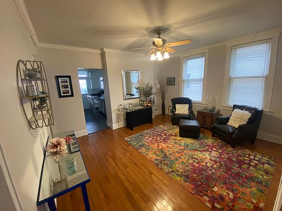 Large room that can be utilized as a dining room or additional living space.