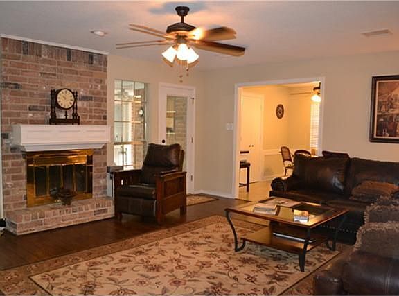 Den with Wood Laminate Floors.