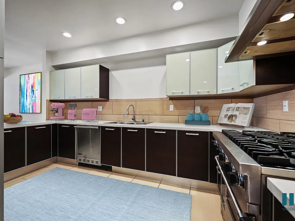 Large-Size Kitchen with Stainless-Steel Appliances and Ample Cabinet Storage