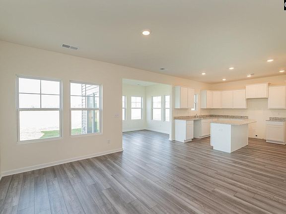 Upgraded luxury vinyl plank flooring in living rm, kitchen, sunroom.