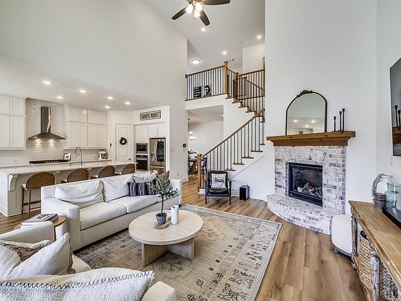 Beauty meets functionality in the design of this home. Tall ceilings are filled with recessed lights and a breezy ceiling fan. The pretty kitchen that is open to the family room is pleasing to the eye, yet it still supplies an abundance of cabinets.