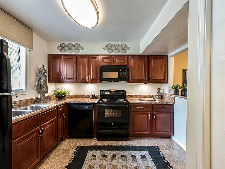 Fully equipped kitchen with Cherry Cabinets