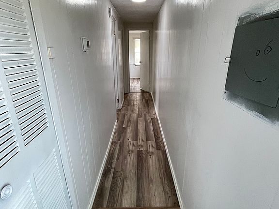 hallway to two bedrooms, one with en-suite