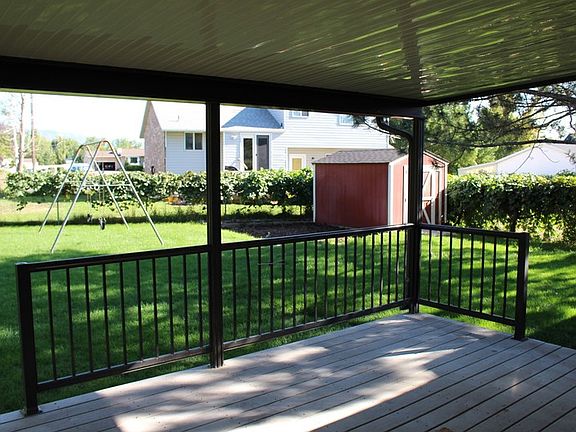 Awesome covered Trex deck in backyard