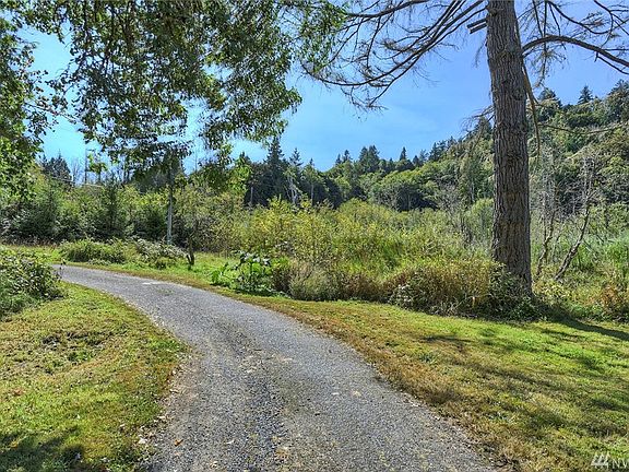 Heading out of the property on your circular driveway - creek to right